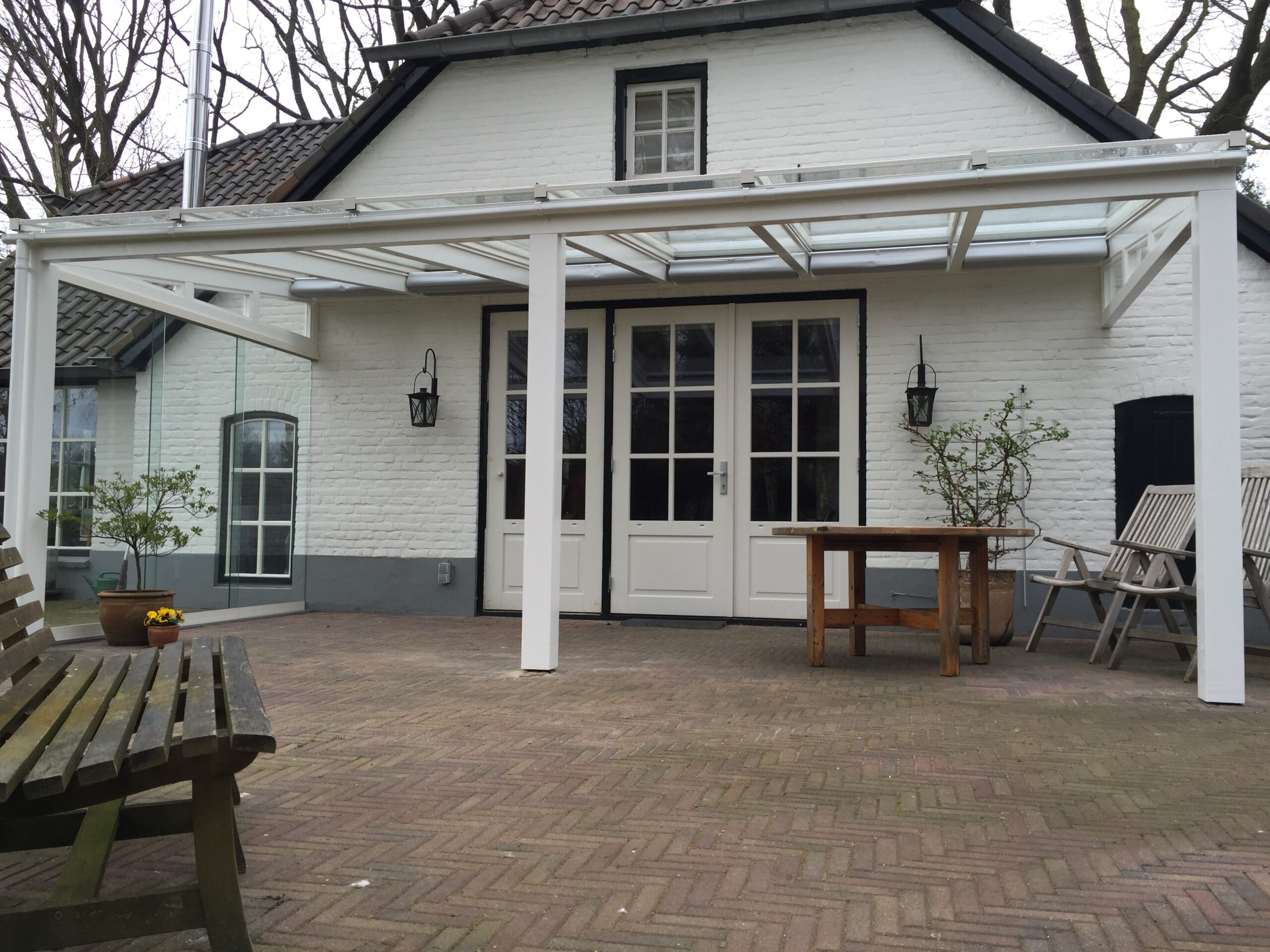 Overkapping aan boerderij met glazen dak